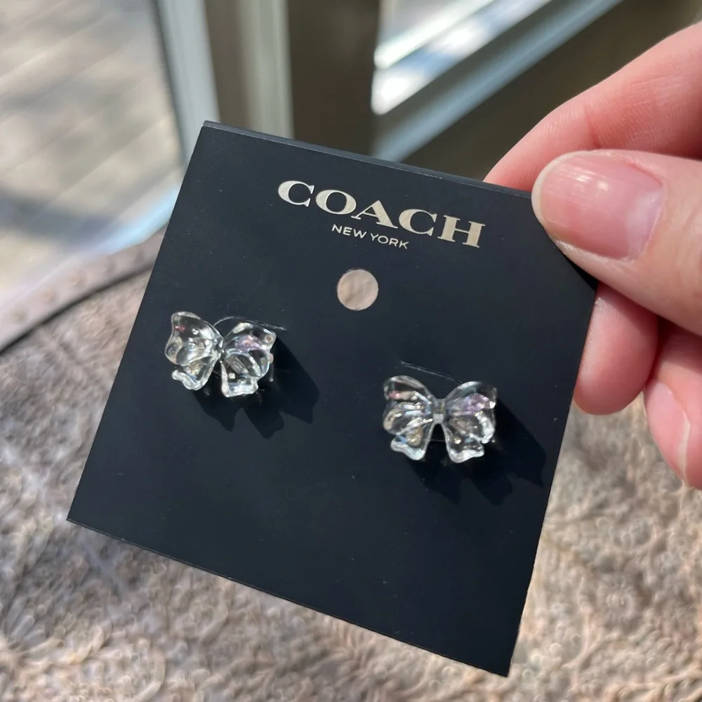 COACH CLEAR BOW STUD EARRINGS - Picture 2 of 4